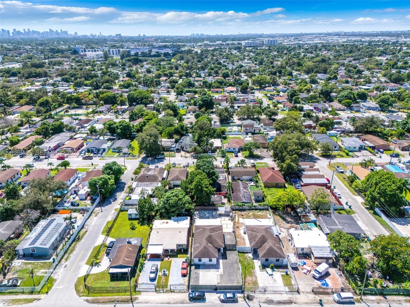 3022 Northwest 95th Street Miami, FL 33147 - Photo 38 of 47 an aerial view of a city with lots of residential buildings