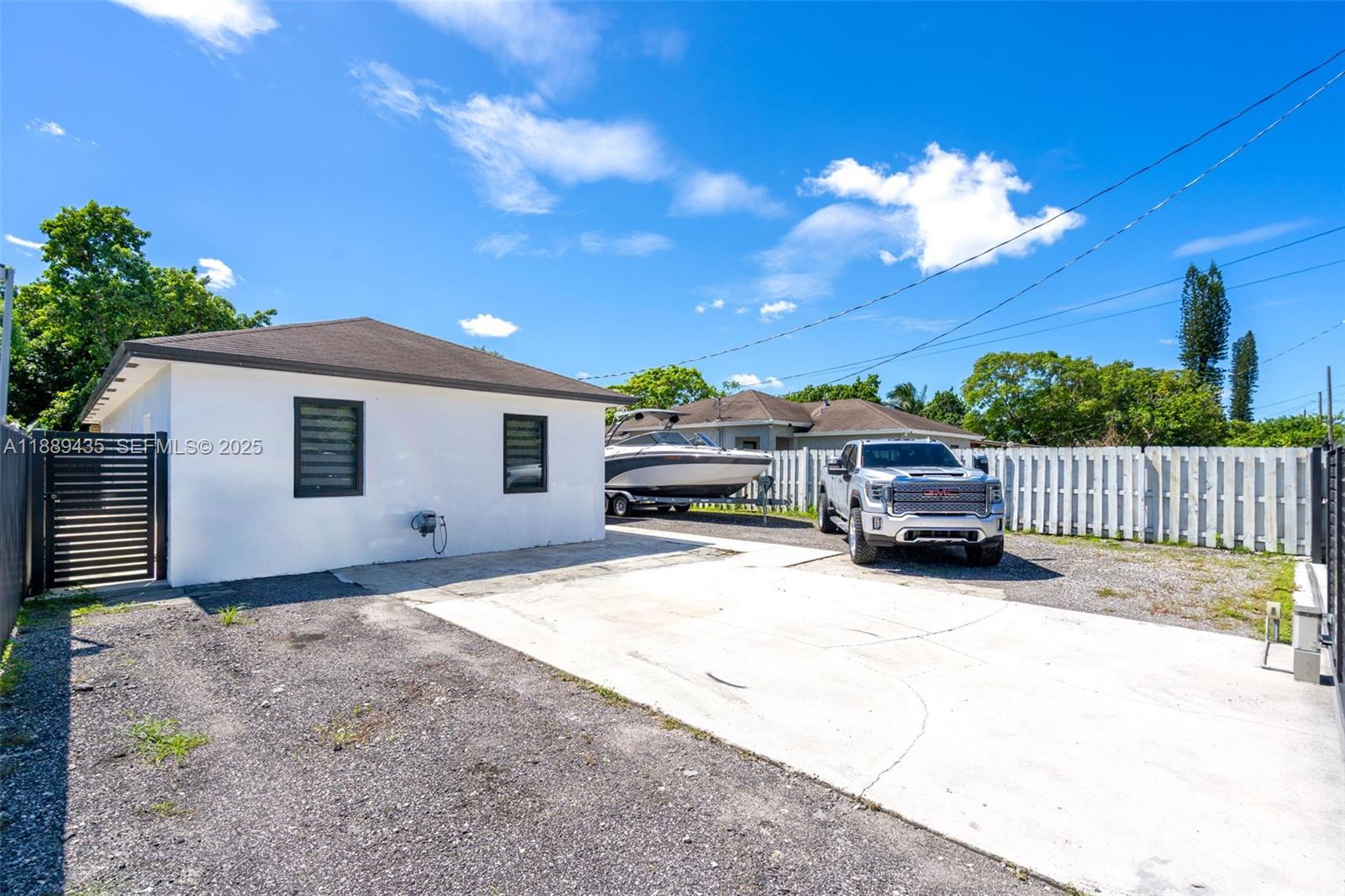 3022 Northwest 95th Street Miami, FL 33147 - Photo 4 of 47 a view of a house with a yard
