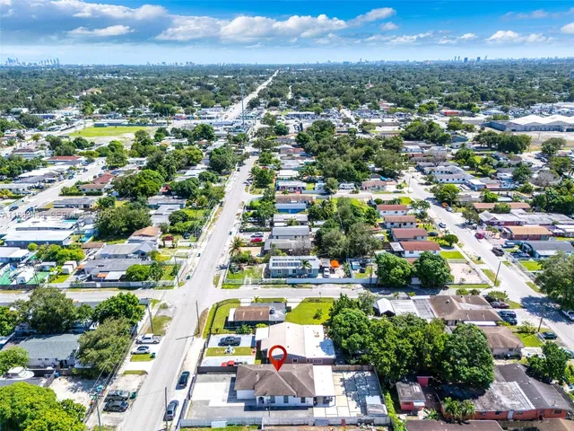 an aerial view of residential houses with outdoor space