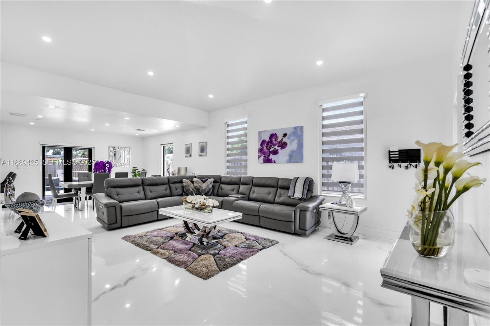3022 Northwest 95th Street Miami, FL 33147 - Photo 7 of 47 a living room with furniture a rug and a potted plant