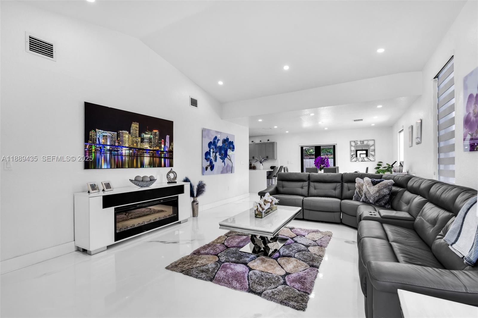 3022 Northwest 95th Street Miami, FL 33147 - Photo 8 of 47 a living room with furniture and a flat screen tv