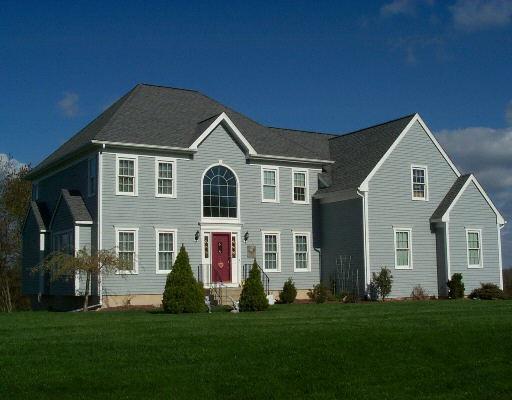 17 Charter Ridge Drive Newtown, CT 06482 - Photo 1 of 1 a front view of a house with a yard