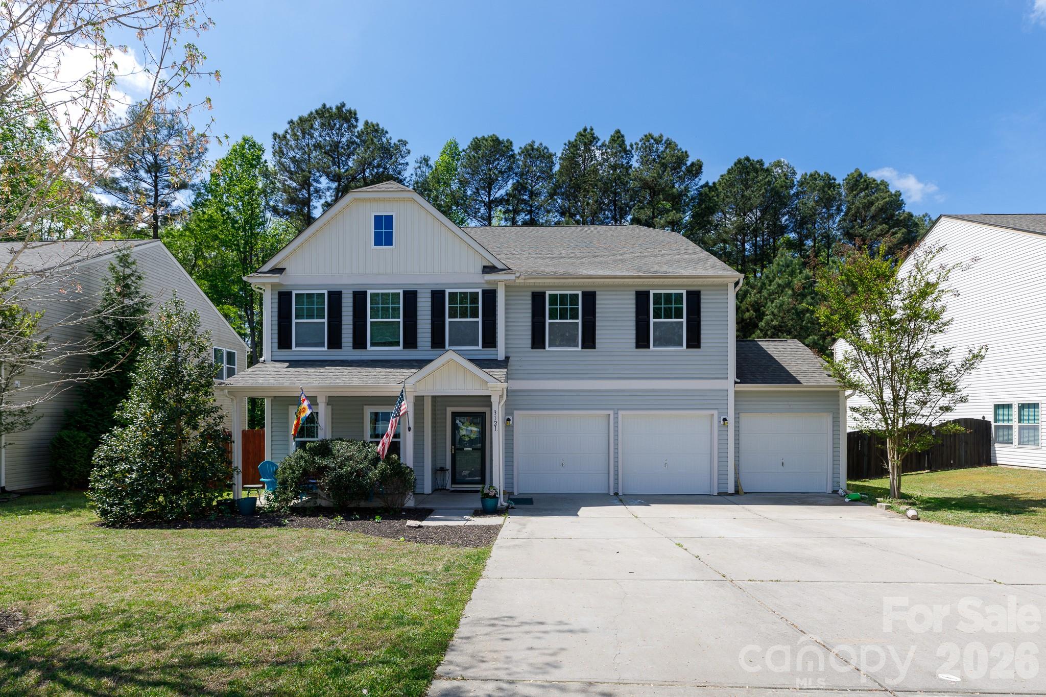 3121 Crosswind Drive Fort Mill, SC 29707 - Photo 1 of 31 a front view of a house with a yard and garage
