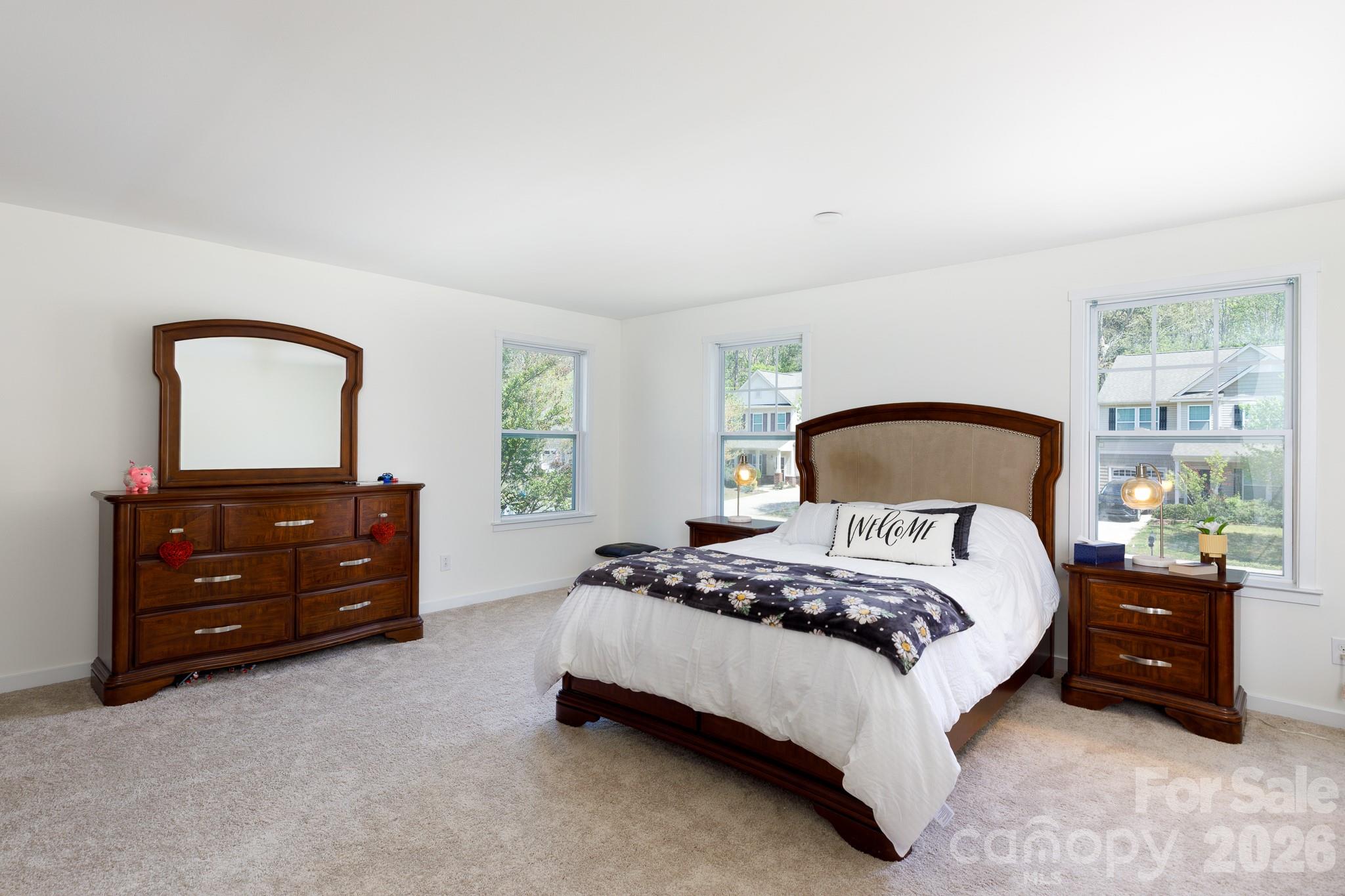 3121 Crosswind Drive Fort Mill, SC 29707 - Photo 18 of 31 a bedroom with a bed and a dresser