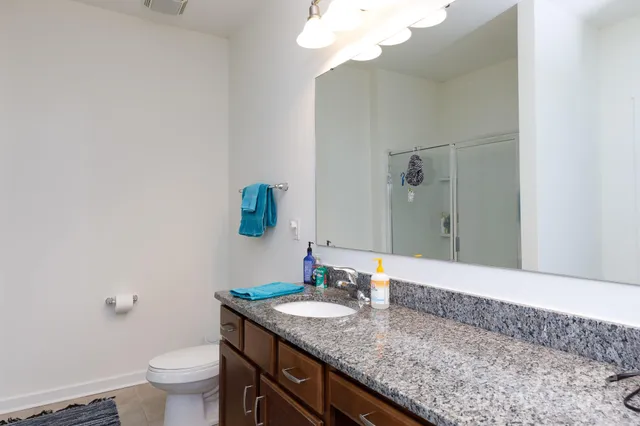 a living room with a bed and a window