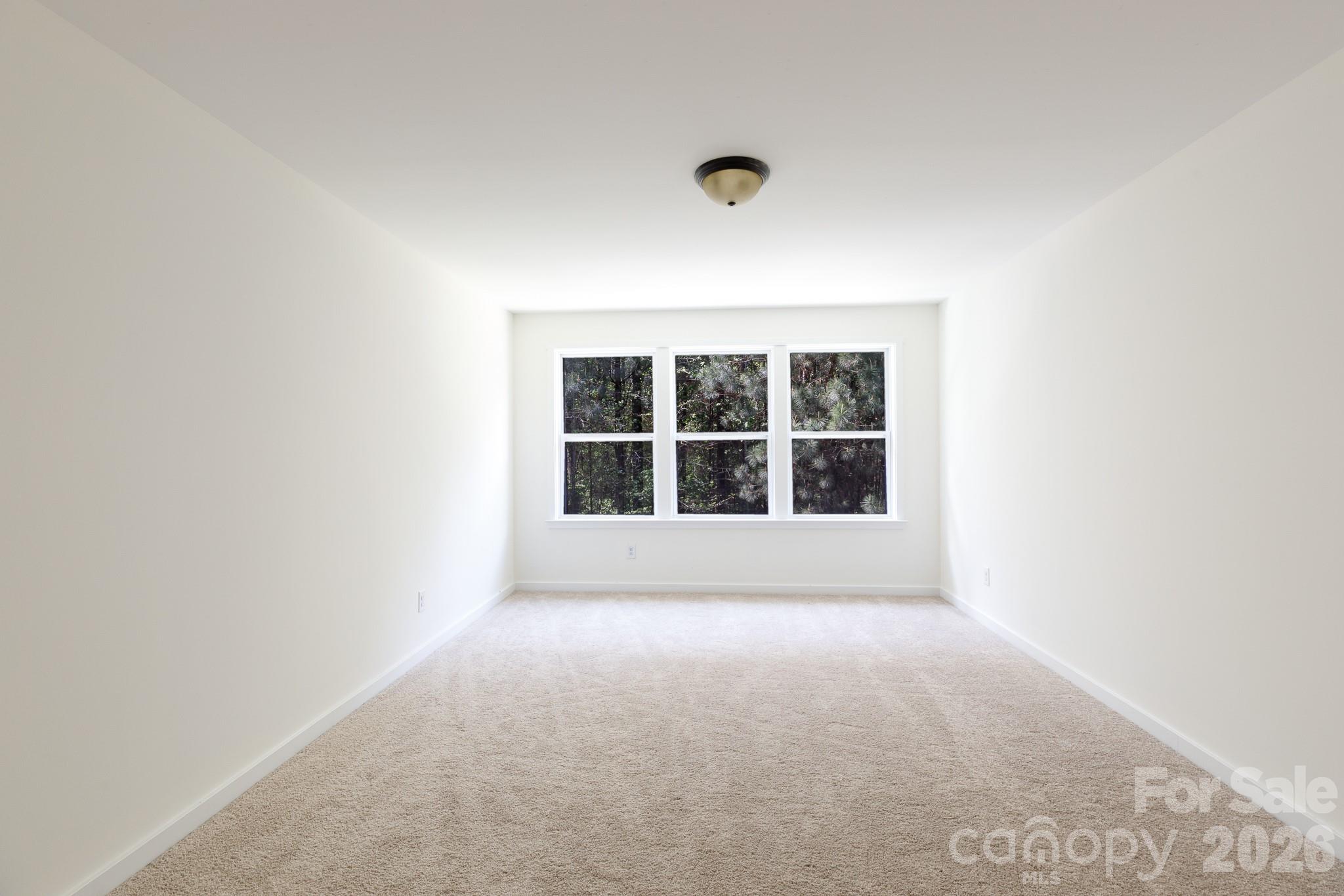 3121 Crosswind Drive Fort Mill, SC 29707 - Photo 19 of 31 a view of an empty room with a window