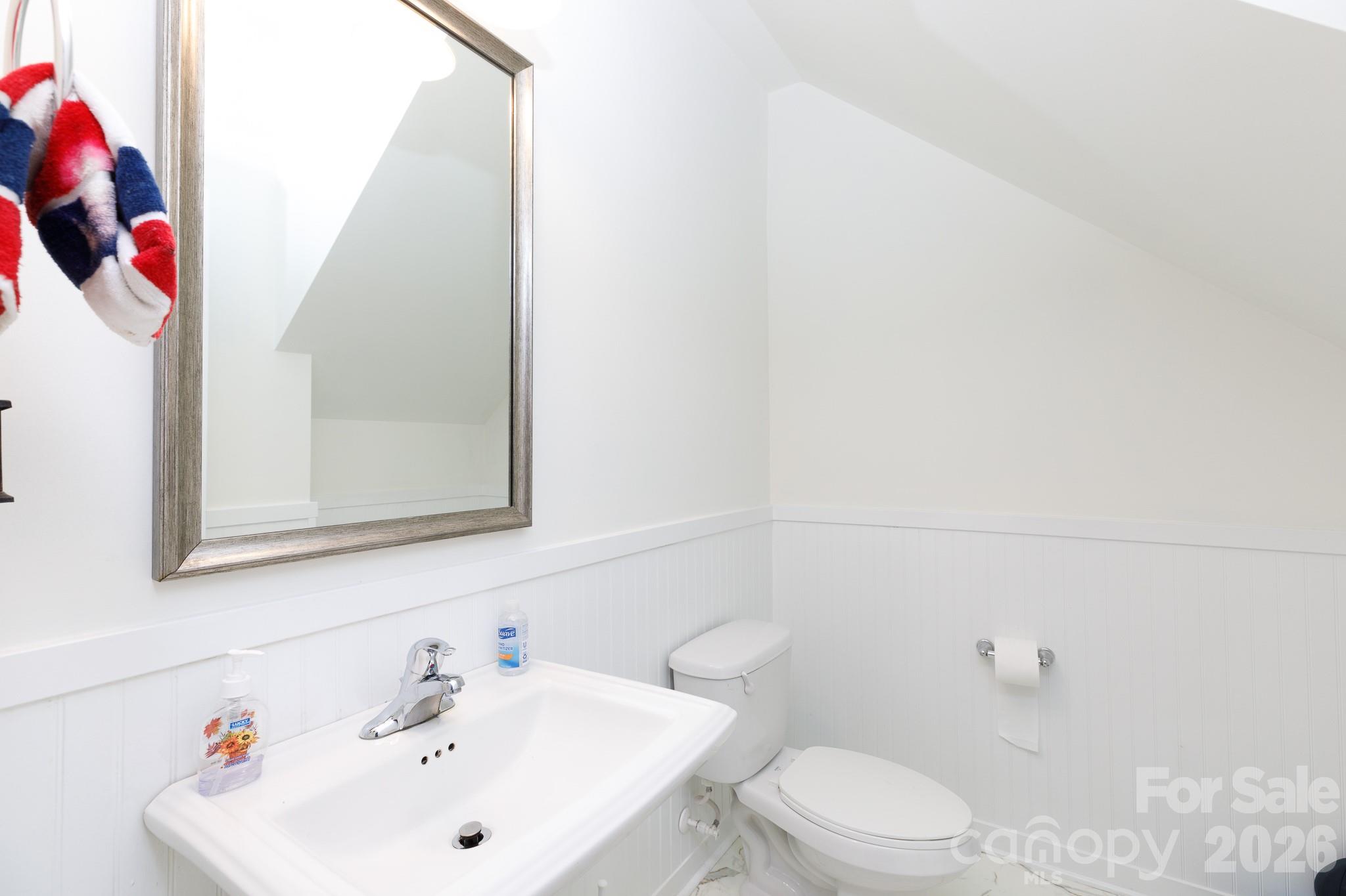3121 Crosswind Drive Fort Mill, SC 29707 - Photo 25 of 31 a white toilet sitting next to a bathroom sink