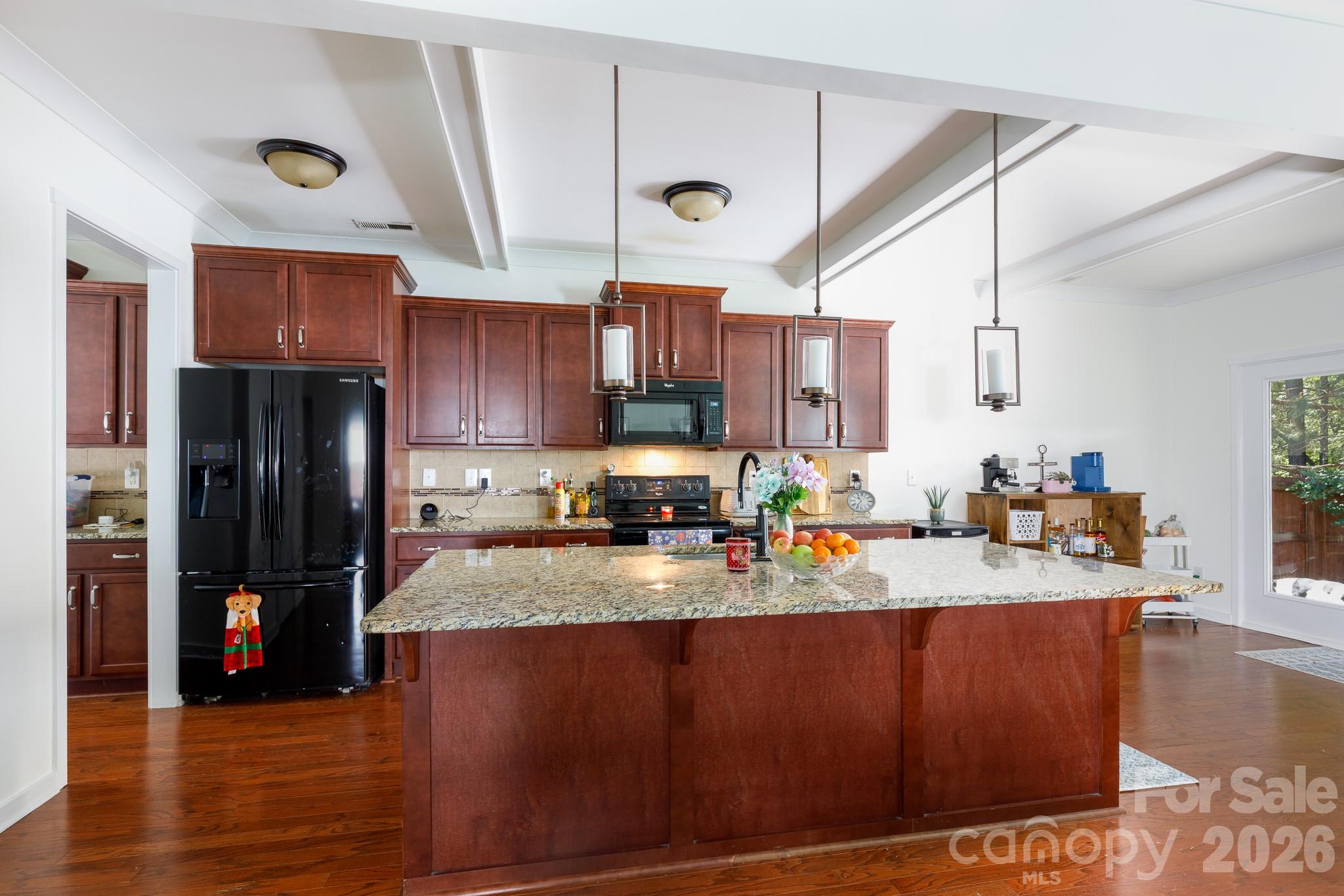 3121 Crosswind Drive Fort Mill, SC 29707 - Photo 8 of 31 a kitchen with stainless steel appliances granite countertop a sink a stove and a refrigerator
