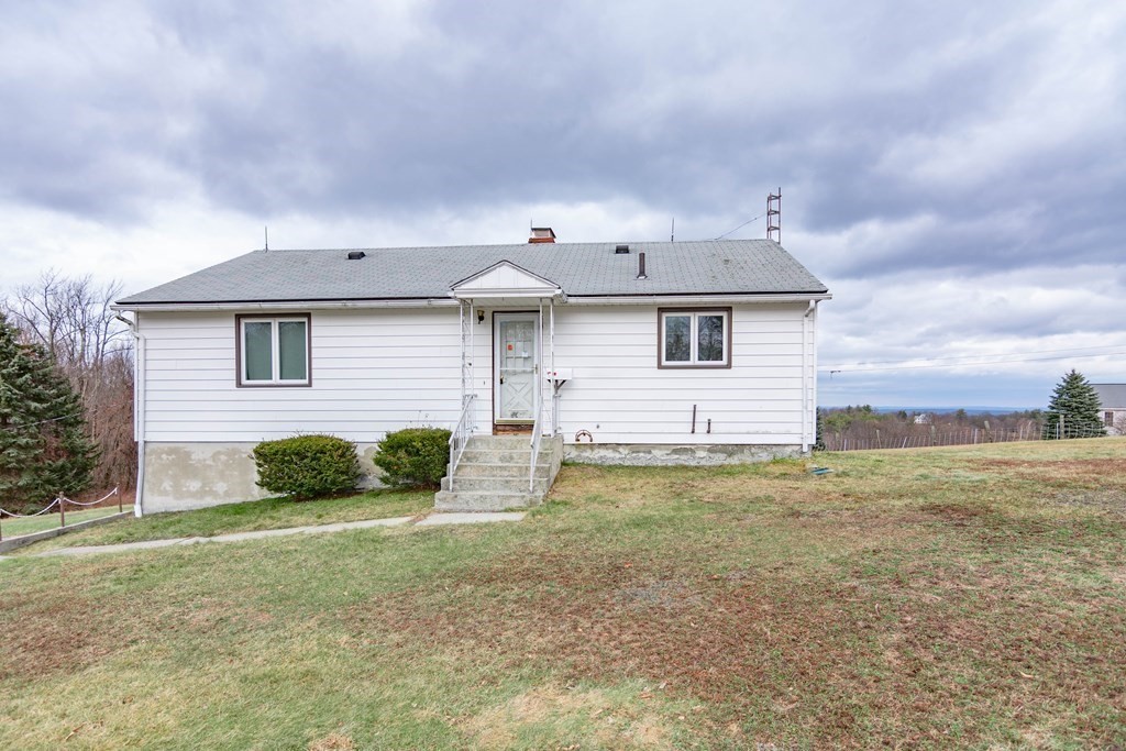 44 Telephone Road Ashby, MA 01431 - Photo 1 of 28 a front view of a house with garden