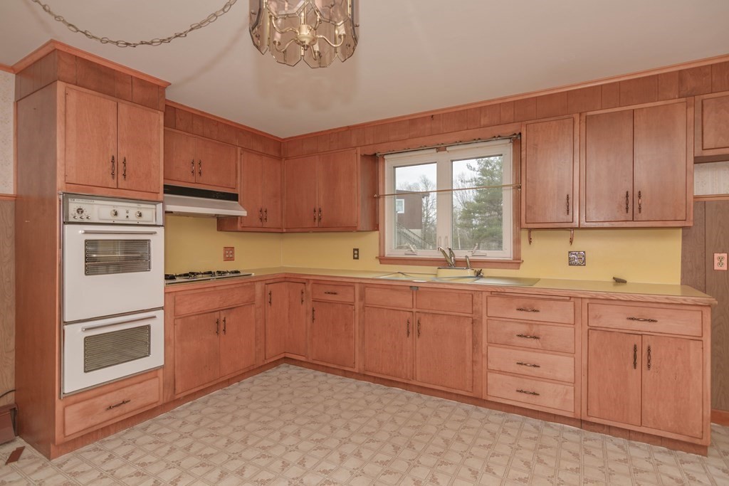 44 Telephone Road Ashby, MA 01431 - Photo 11 of 28 a kitchen with stainless steel appliances granite countertop a stove sink and cabinets