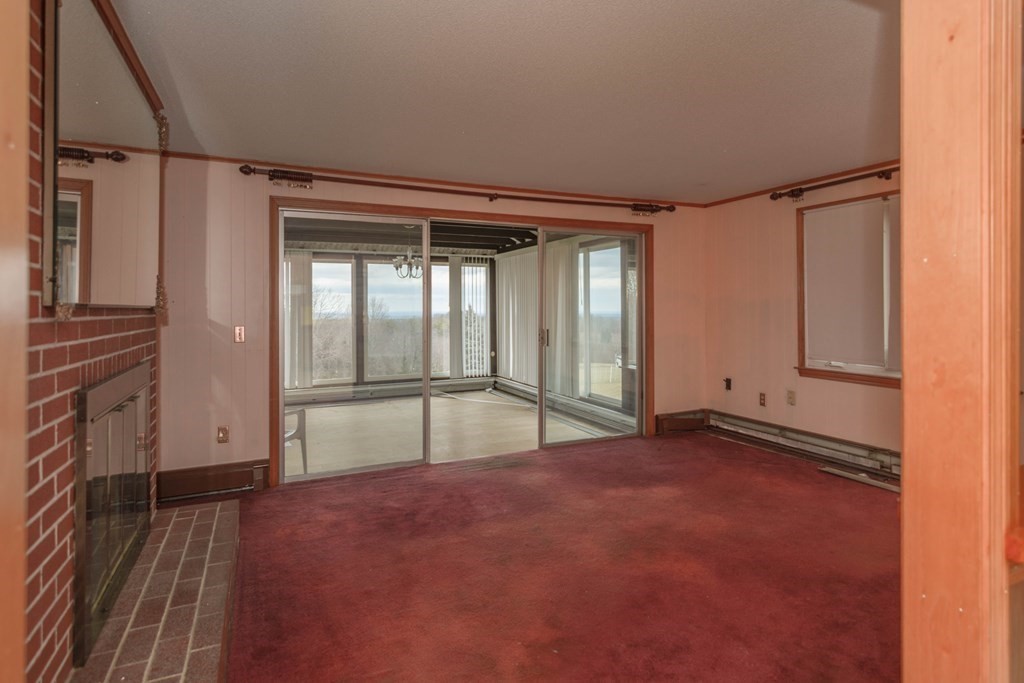 44 Telephone Road Ashby, MA 01431 - Photo 12 of 28 a view of an empty room with a window