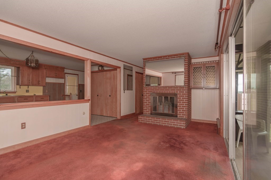 44 Telephone Road Ashby, MA 01431 - Photo 15 of 28 an empty room with chandelier fan and windows