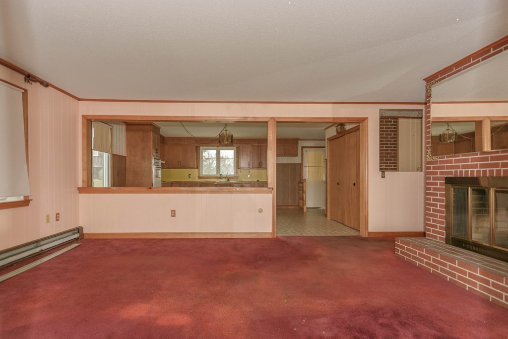 44 Telephone Road Ashby, MA 01431 - Photo 19 of 28 a view of an empty room with kitchen and window