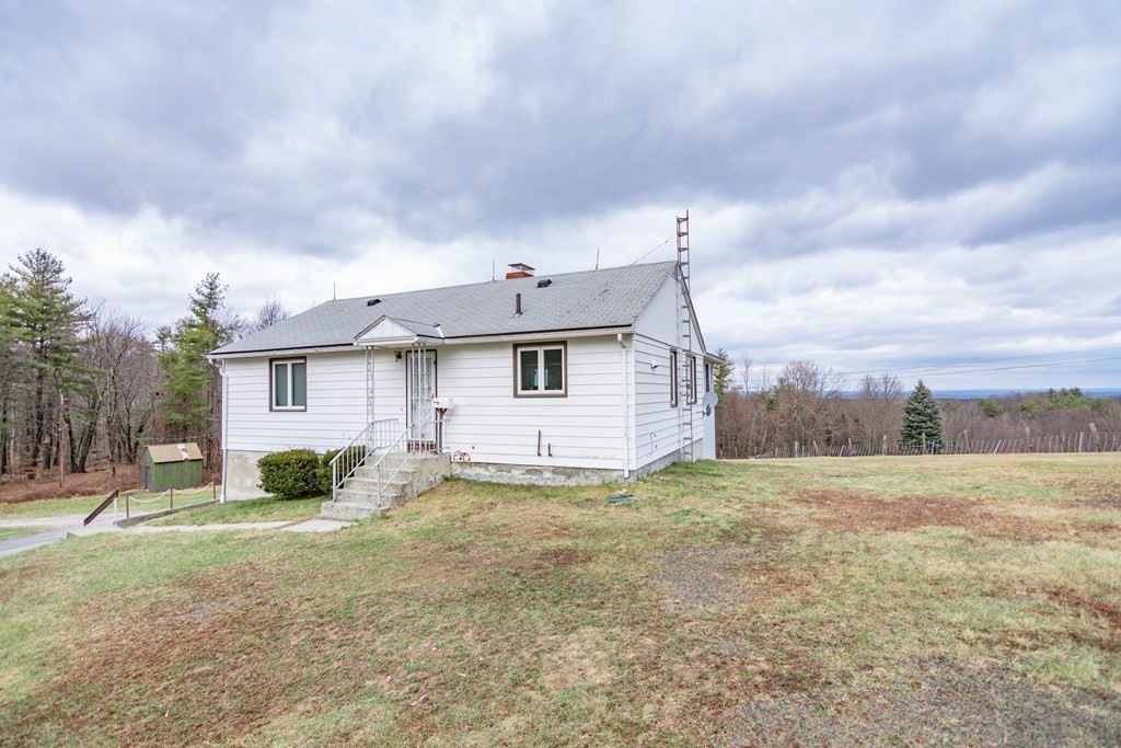 44 Telephone Road Ashby, MA 01431 - Photo 2 of 28 a view of a house with a yard