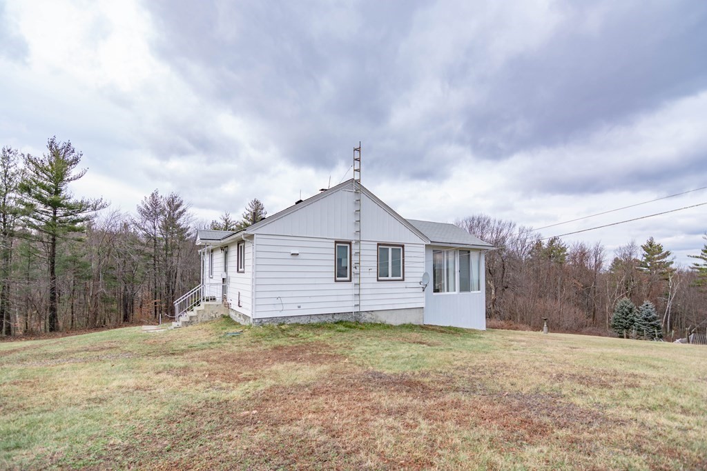 44 Telephone Road Ashby, MA 01431 - Photo 4 of 28 a view of a house with a yard