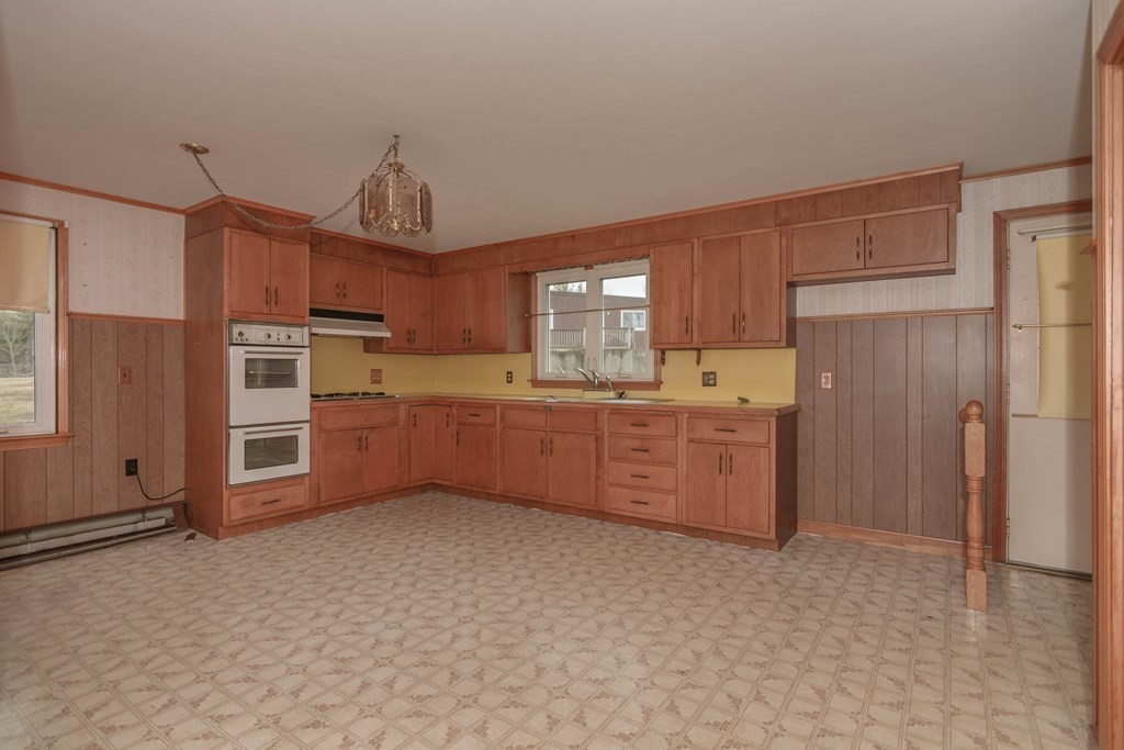 44 Telephone Road Ashby, MA 01431 - Photo 9 of 28 a kitchen with stainless steel appliances a refrigerator and a sink