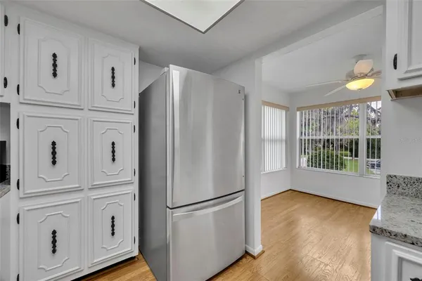 a kitchen with stainless steel appliances a refrigerator and a stove