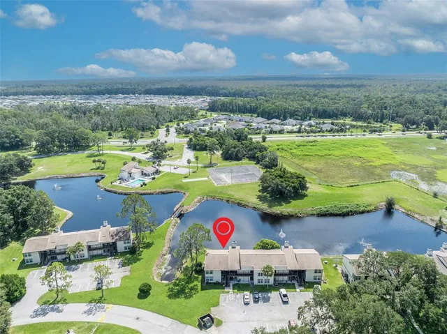 an aerial view of a house with yard swimming pool and outdoor seating