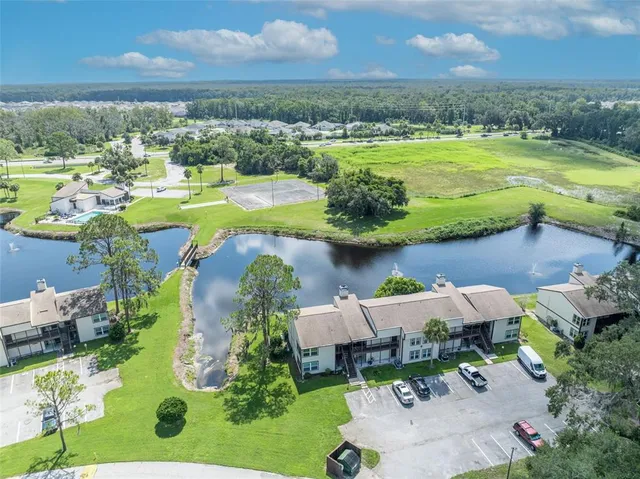 an aerial view of a house with outdoor space