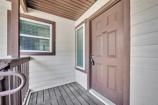 a view of front door and deck of the house