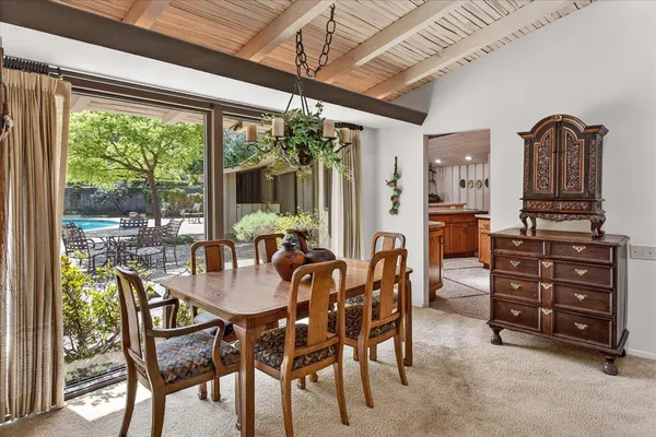 a view of a dining room with furniture window and outside view