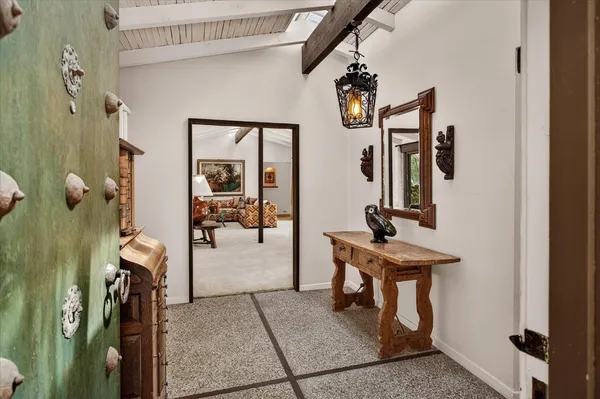 a view of a livingroom with furniture and front door