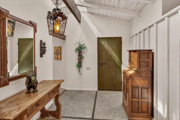 a room that has a bed and a table in it