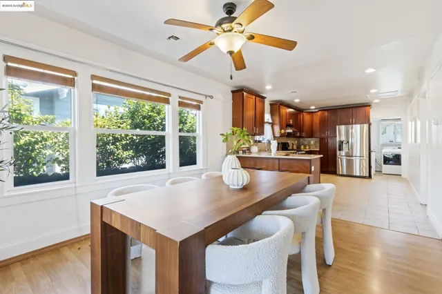 a kitchen with a table chairs and entryway