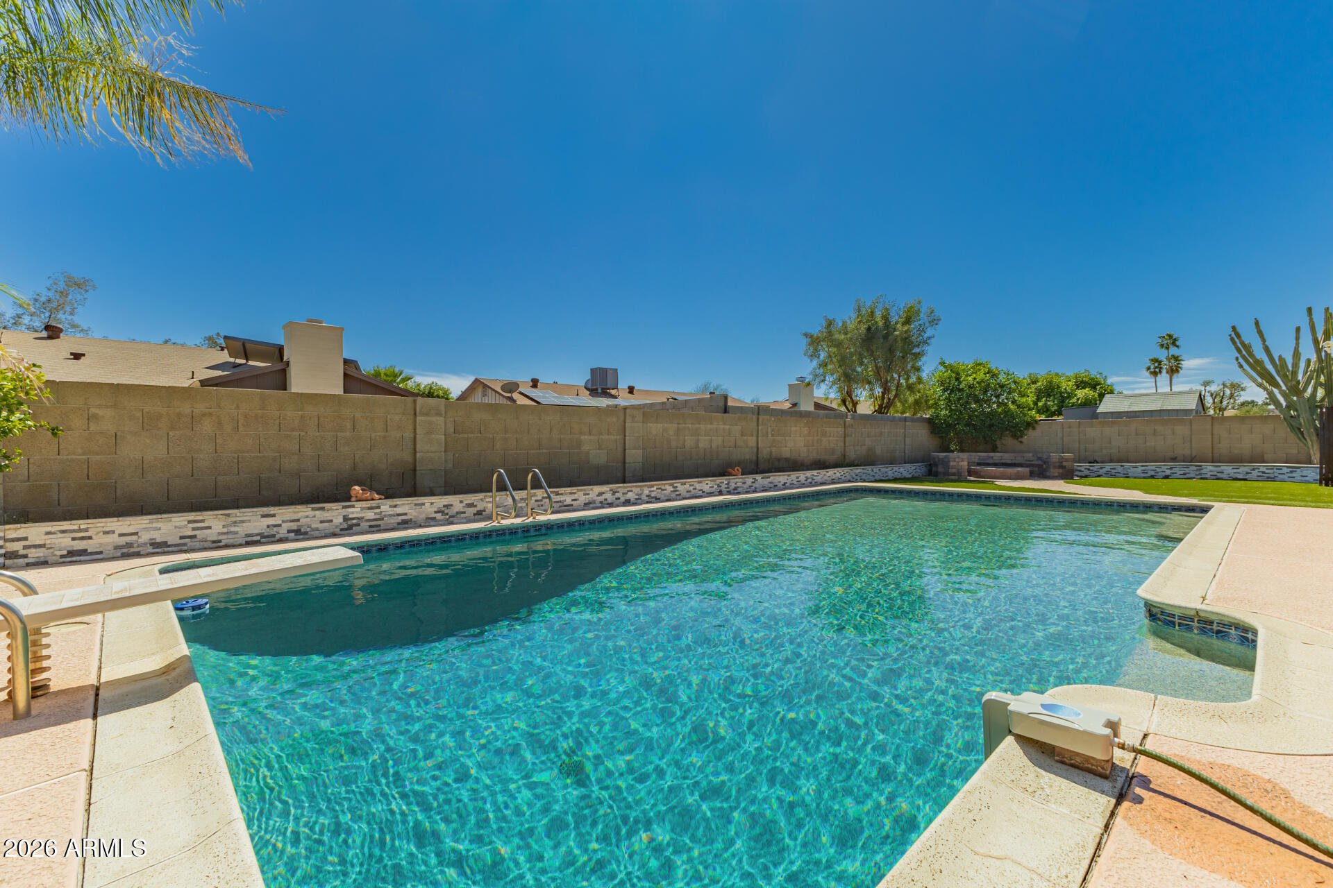 2915 West Hearn Road Phoenix, AZ 85053 - Photo 25 of 28 a view of a backyard with couches plants and large tree