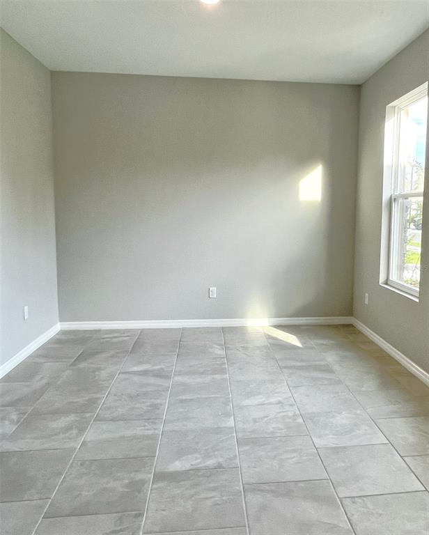 7724 Broad River Avenue Land O Lakes, FL 34638 - Photo 12 of 40 a view of an empty room and window
