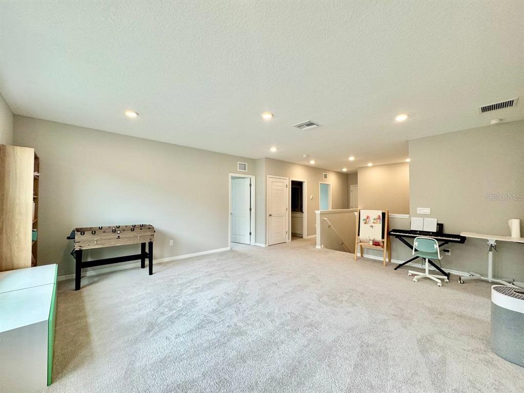 7724 Broad River Avenue Land O Lakes, FL 34638 - Photo 17 of 40 a view of work space with windows