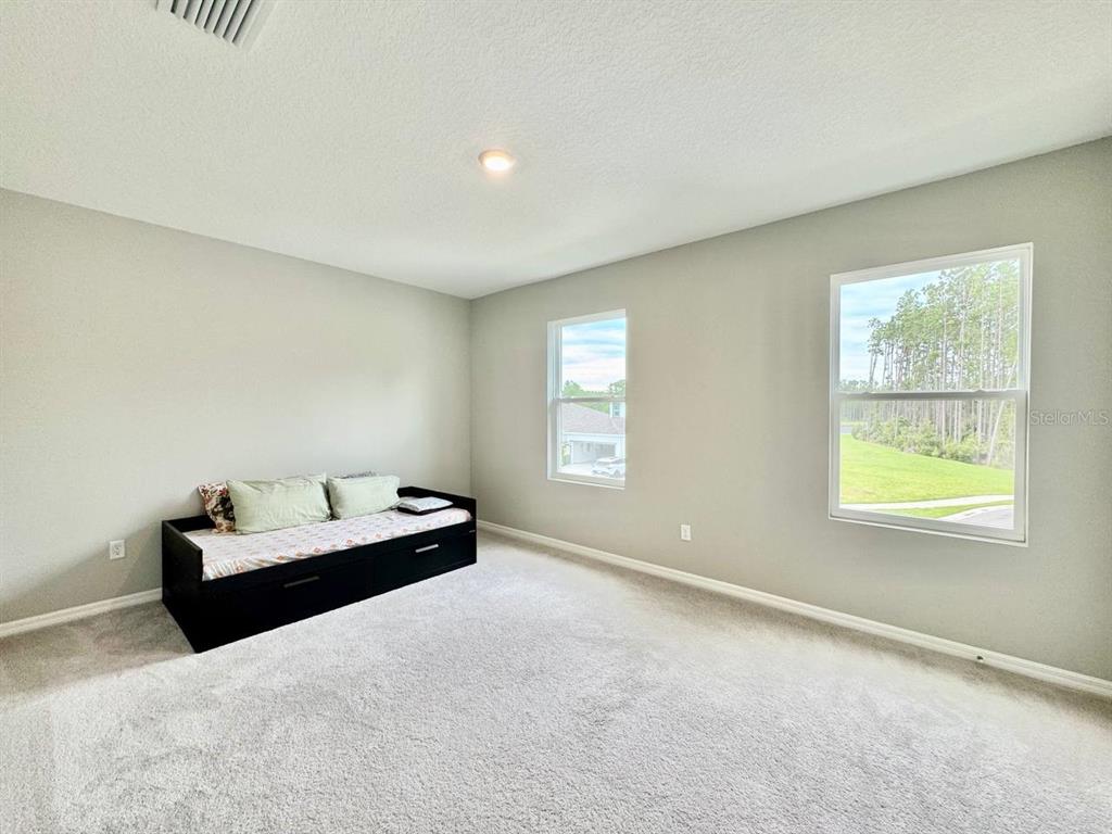 7724 Broad River Avenue Land O Lakes, FL 34638 - Photo 19 of 40 a living room with furniture and a window