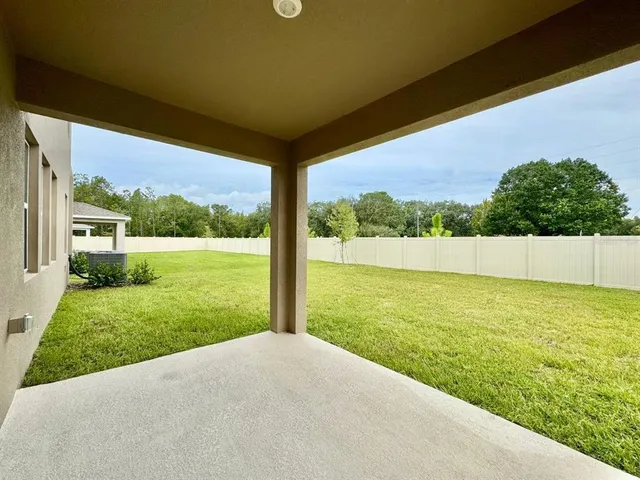 a view of a yard with an outdoor space