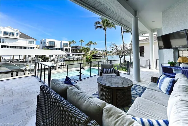 a view of a patio with swimming pool table and chairs