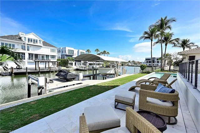 a view of a swimming pool with a patio