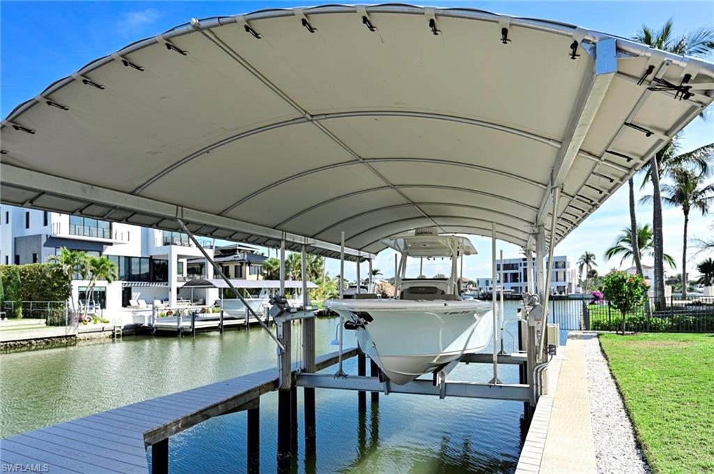 271 Bayview Avenue Naples, FL 34108 - Photo 17 of 35 a view of a swimming pool with a patio