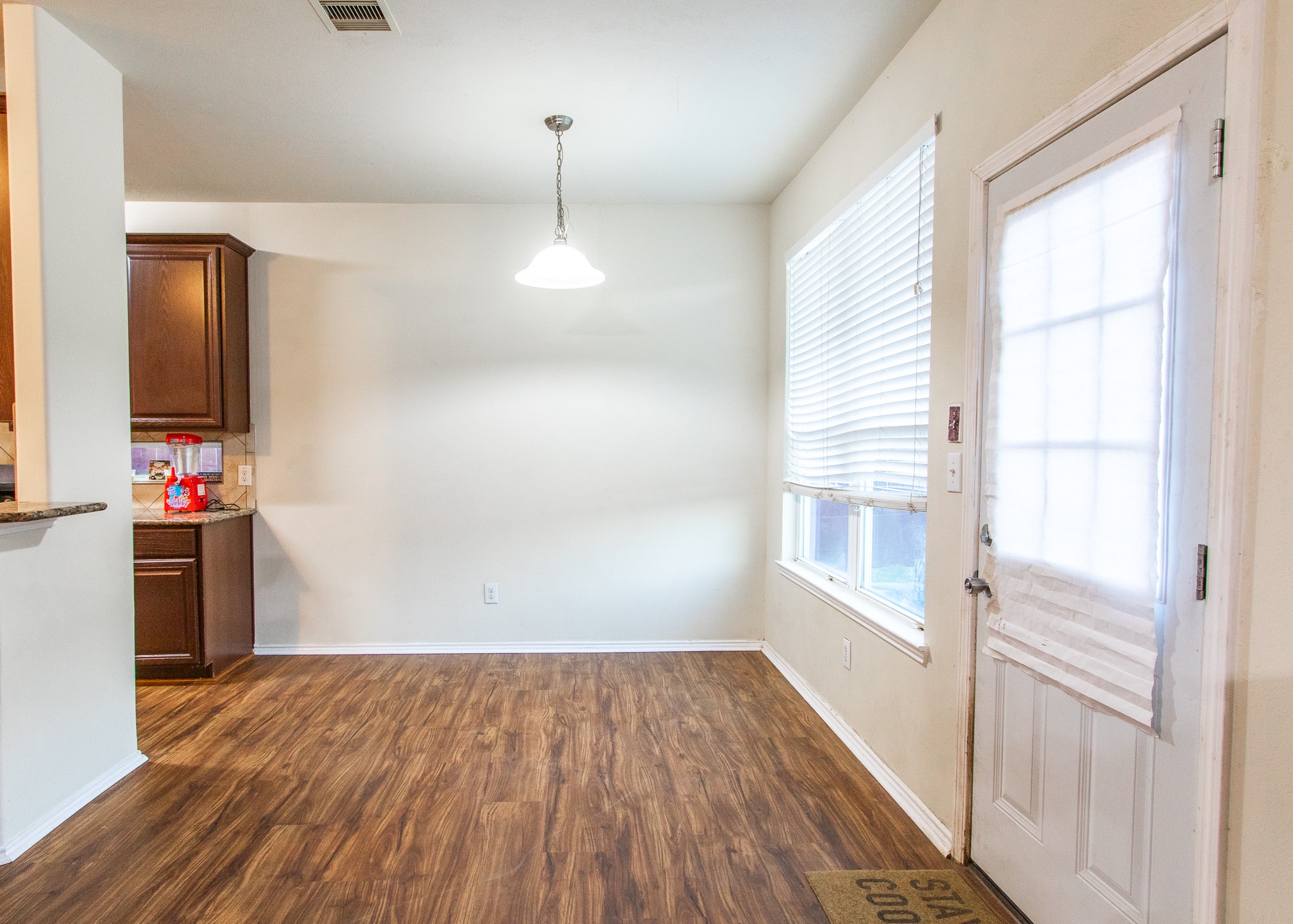 1107 Arum Road Missouri City, TX 77489 - Photo 6 of 23 Cheerful breakfast area is perfect for quick, informal meals. The breakfast area opens to family room and is adjacent to the kitchen. Enjoy peaceful views of the backyard.