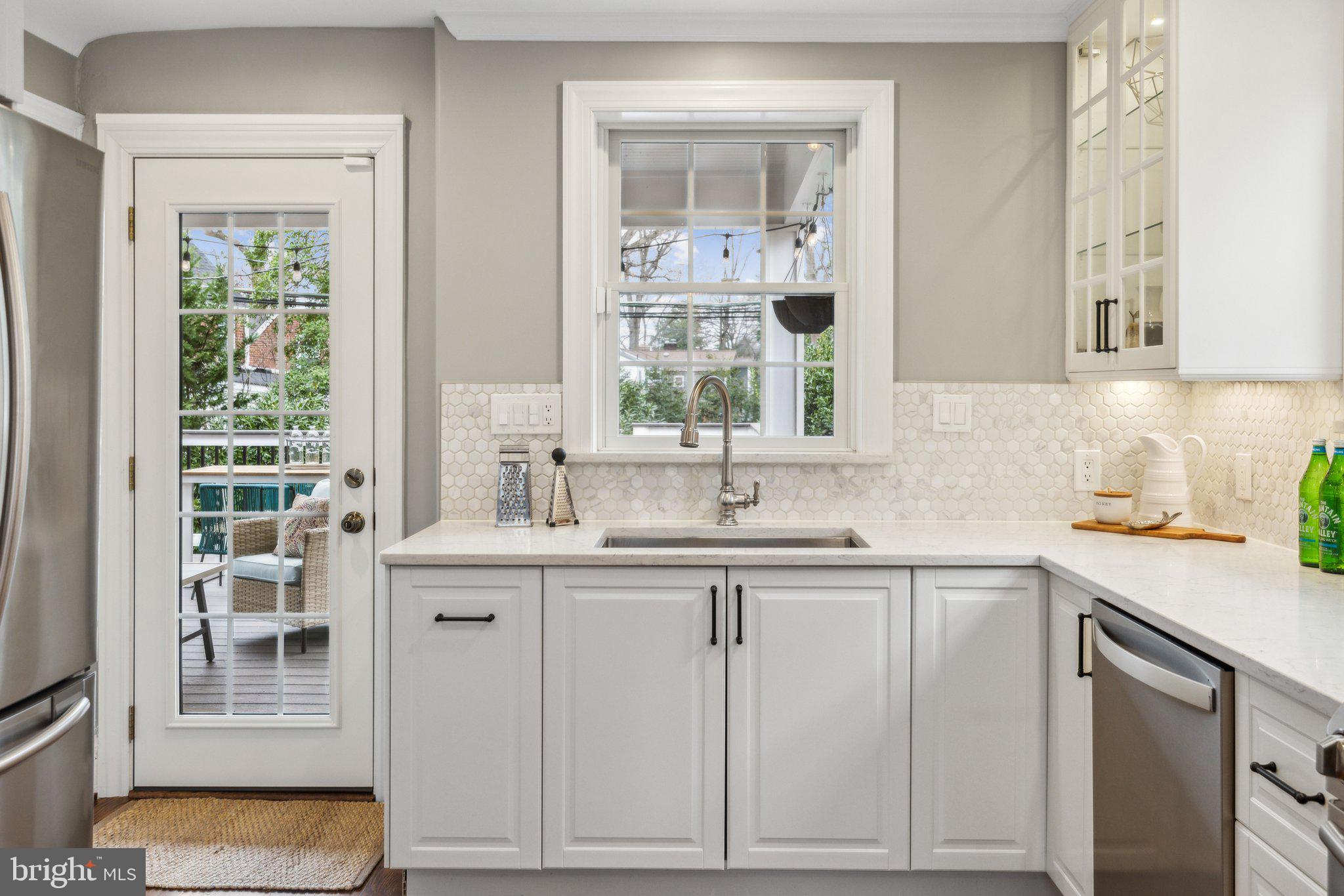3808 North Pershing Drive Arlington, VA 22203 - Photo 15 of 42 a kitchen with white cabinets and sink