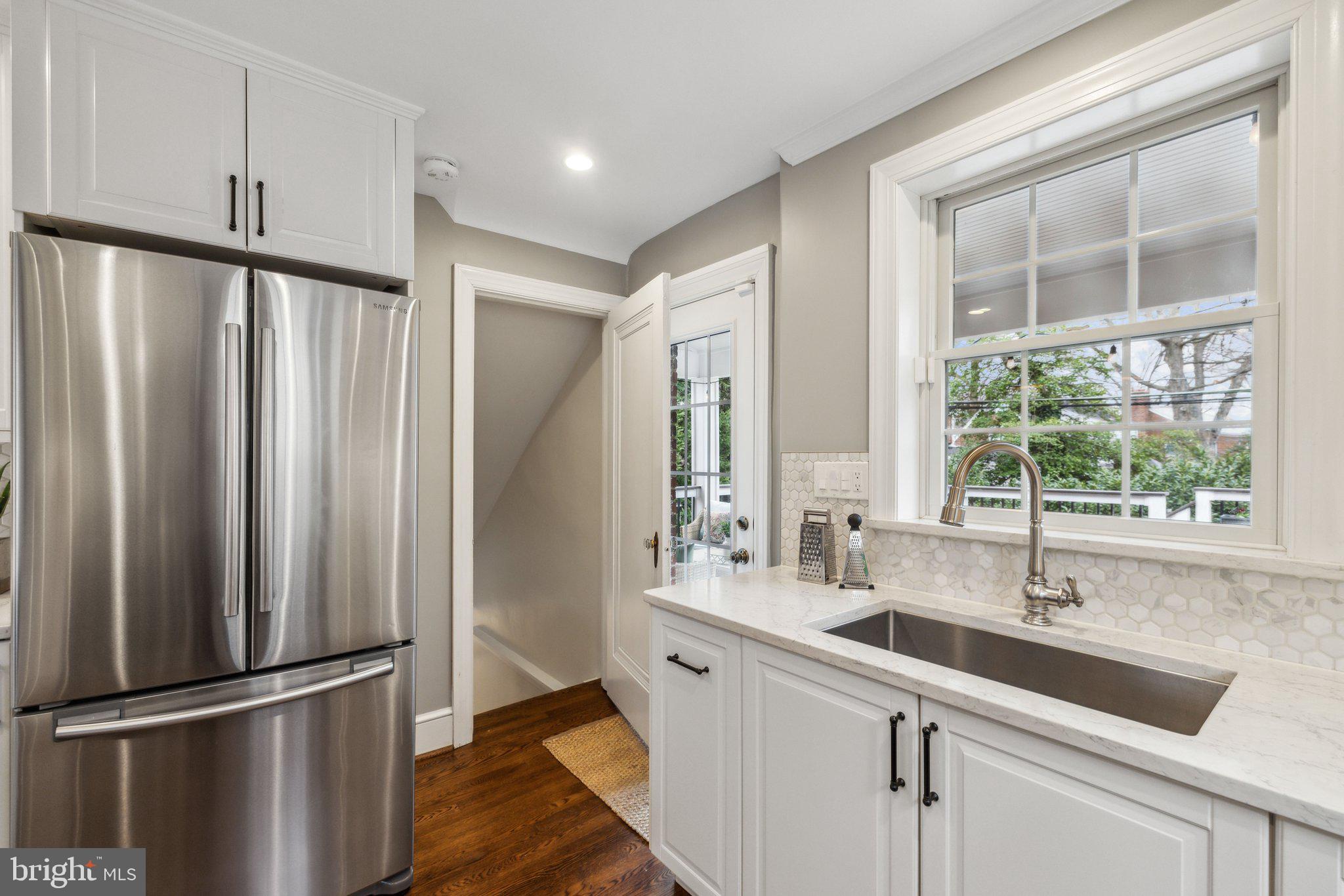 3808 North Pershing Drive Arlington, VA 22203 - Photo 17 of 42 a kitchen with stainless steel appliances a sink and a window