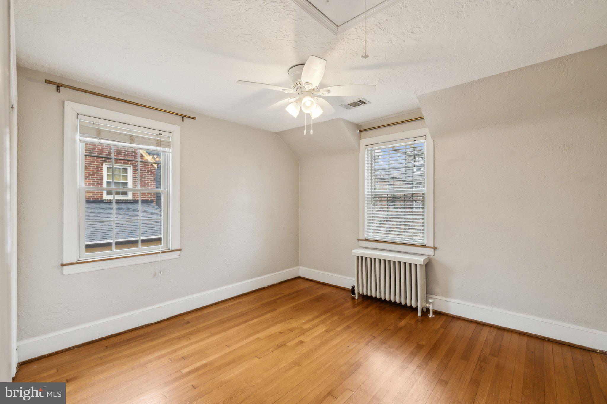 3808 North Pershing Drive Arlington, VA 22203 - Photo 23 of 42 wooden floor in an empty room with a window