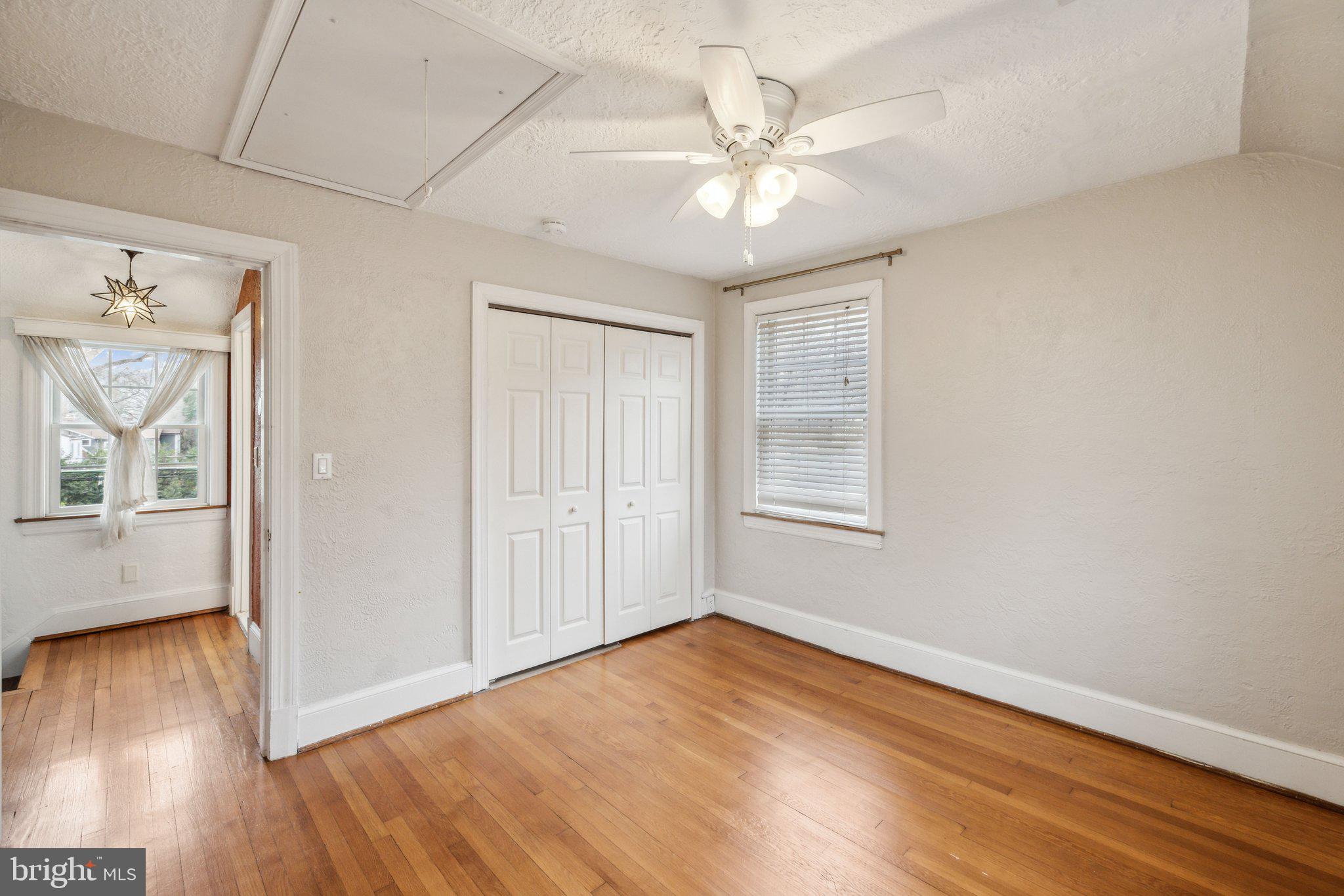 3808 North Pershing Drive Arlington, VA 22203 - Photo 24 of 42 a view of an empty room with wooden floor and a window