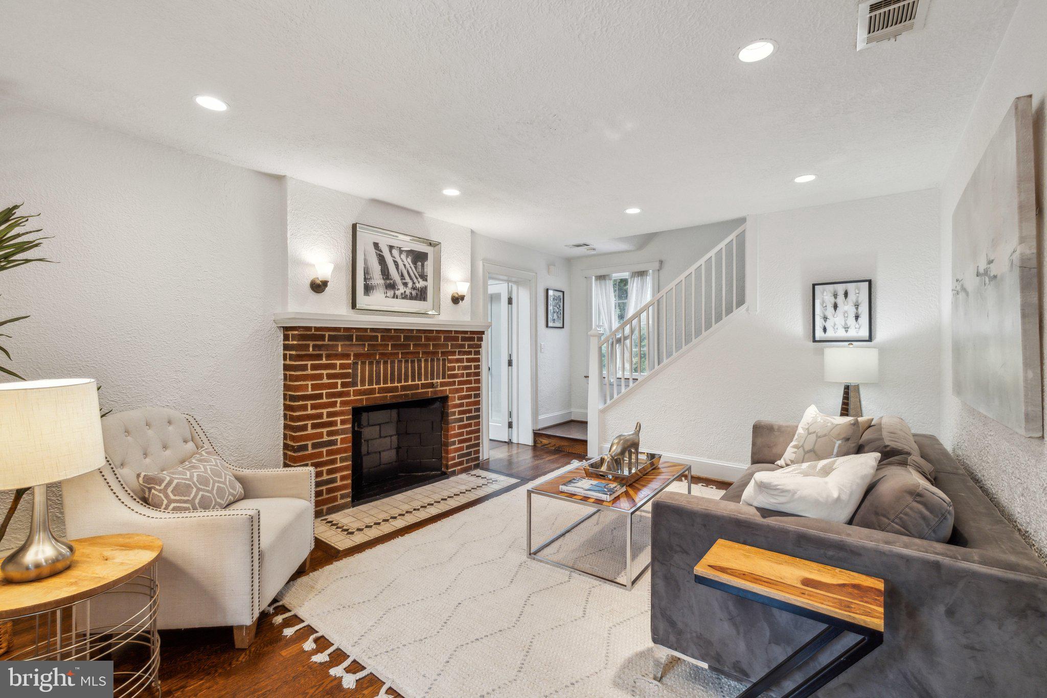 3808 North Pershing Drive Arlington, VA 22203 - Photo 3 of 42 a living room with furniture or couch and a fireplace