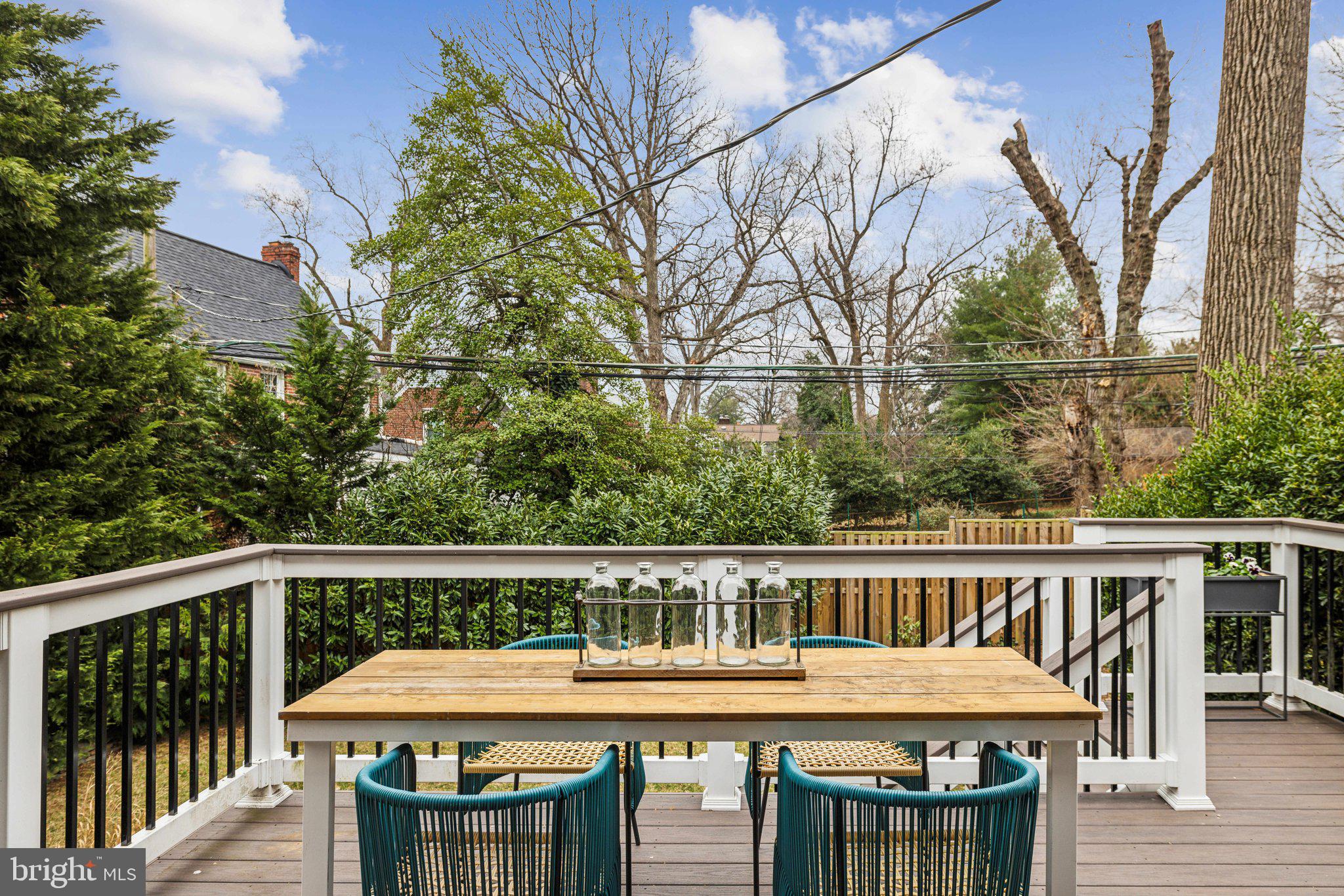 3808 North Pershing Drive Arlington, VA 22203 - Photo 35 of 42 a view of a wooden chairs and table in the balcony