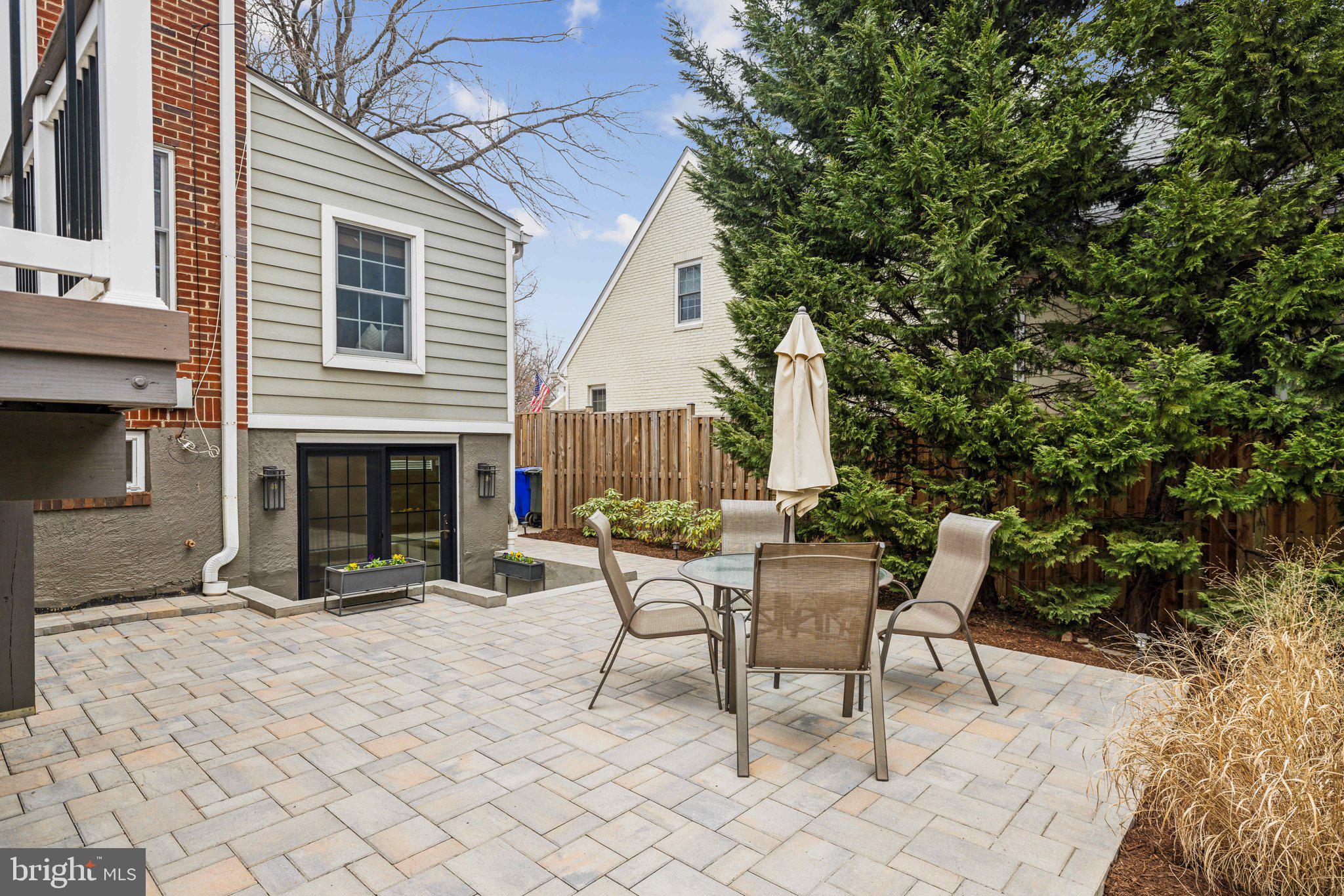 3808 North Pershing Drive Arlington, VA 22203 - Photo 36 of 42 a view of a patio with table and chairs and a barbeque