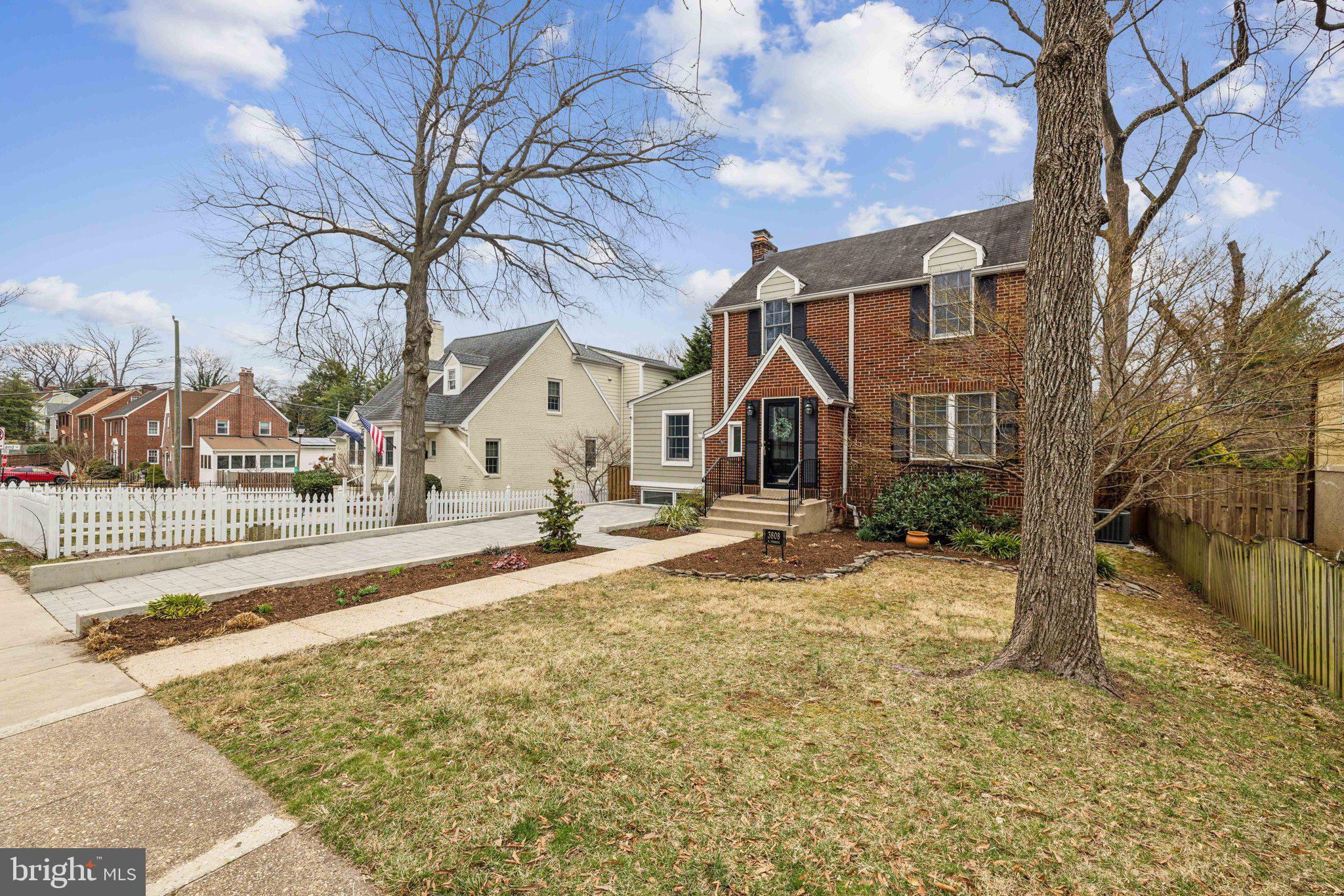 3808 North Pershing Drive Arlington, VA 22203 - Photo 7 of 42 a view of a white house with a yard covered in snow