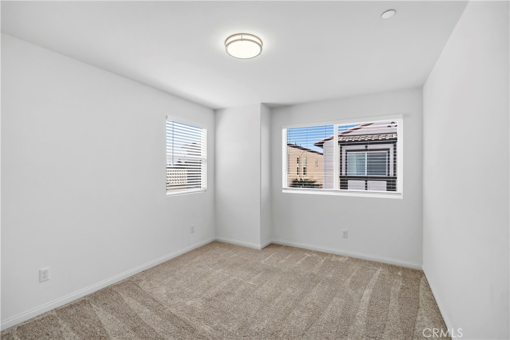 335 Carson Court Rialto, CA 92376 - Photo 18 of 34 a view of a livingroom with an empty space & a window
