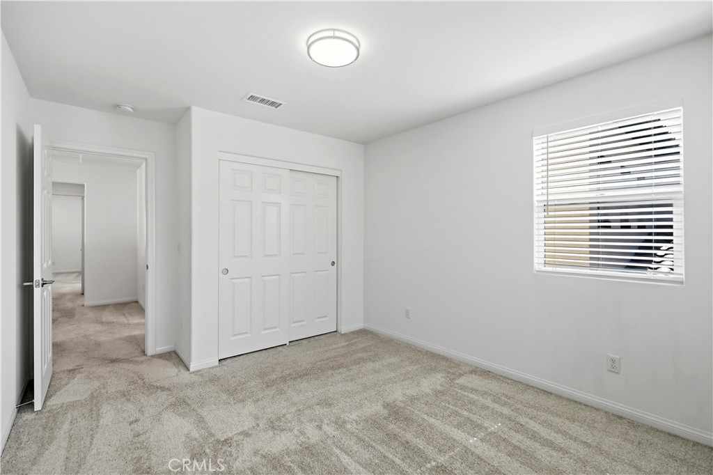 335 Carson Court Rialto, CA 92376 - Photo 19 of 34 a view of an empty room with a window