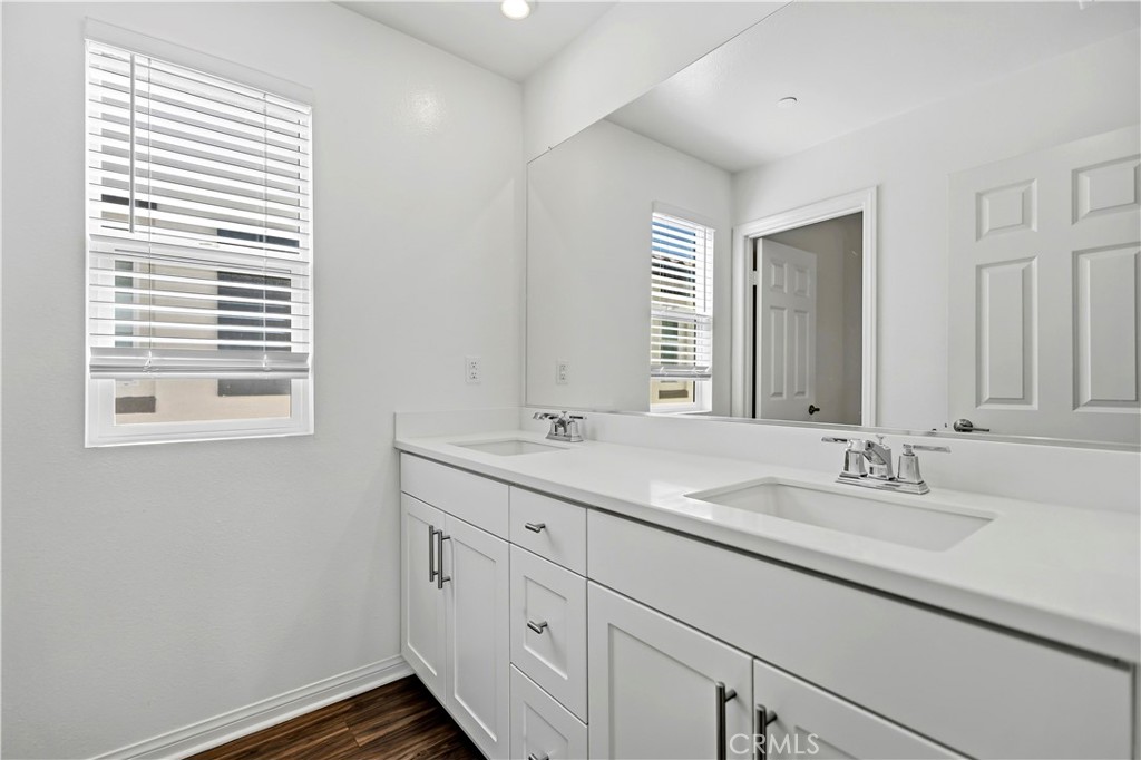 335 Carson Court Rialto, CA 92376 - Photo 20 of 34 a bathroom with a sink and a window