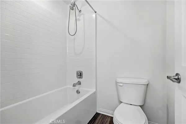 a bathroom with a toilet and a bathtub