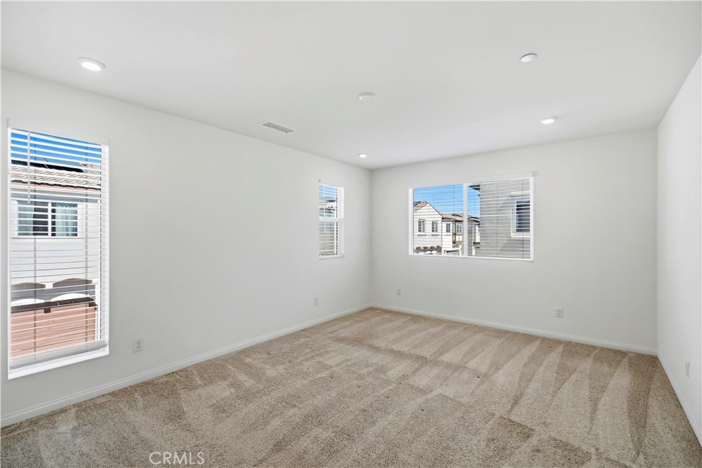 335 Carson Court Rialto, CA 92376 - Photo 10 of 34 a view of an empty room with a window
